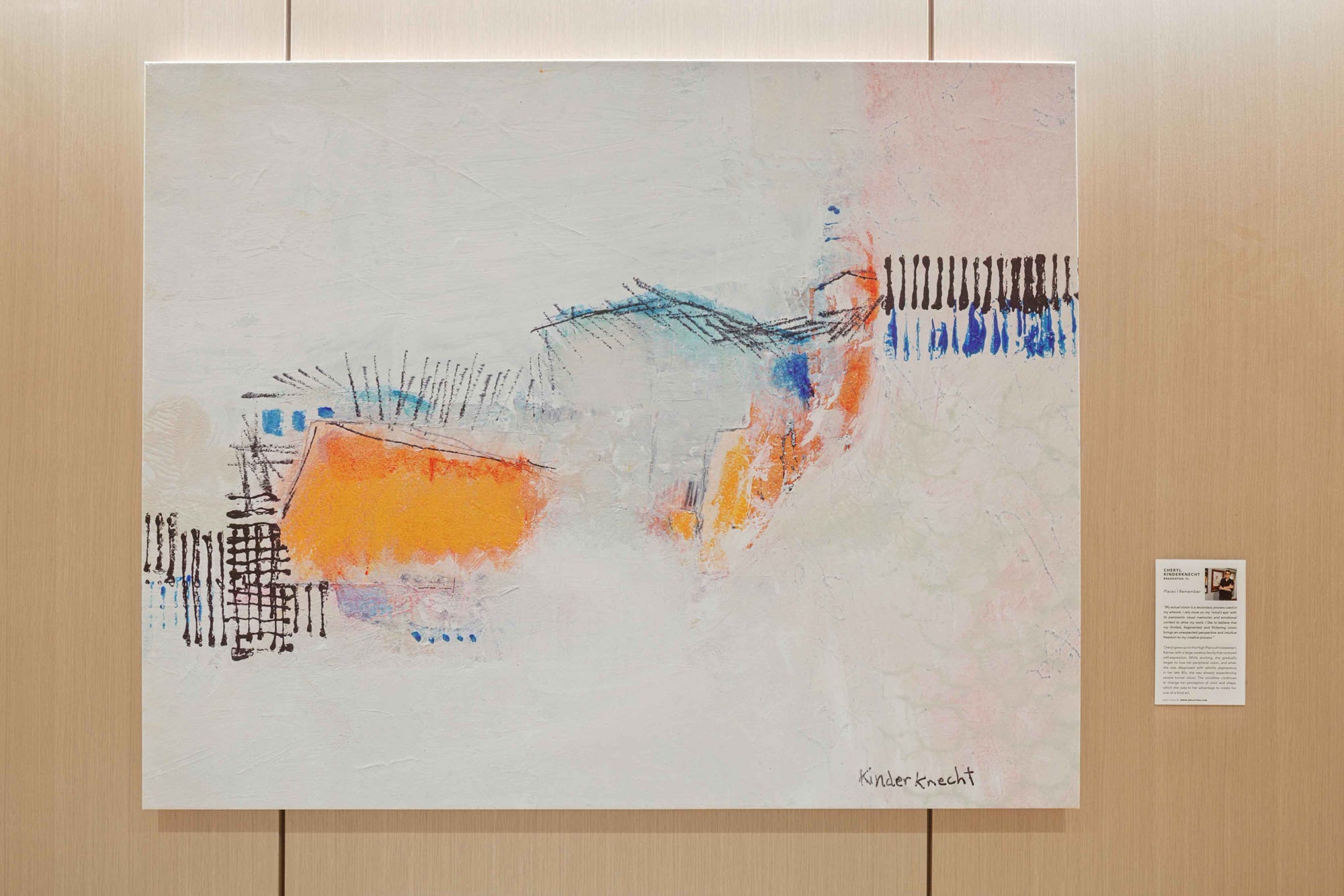 Abstract artwork with colorful brush strokes on a wooden panel